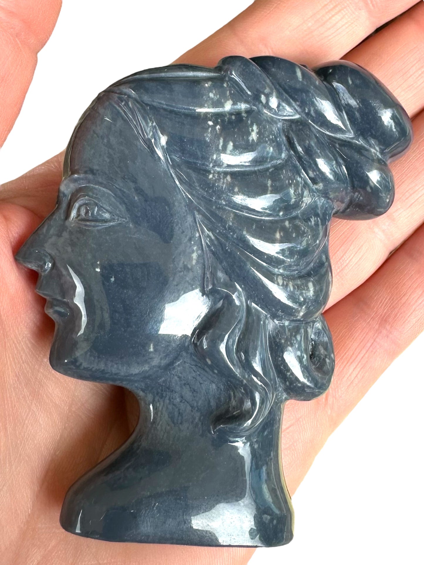 Australian opal potch cameo carving on stand.