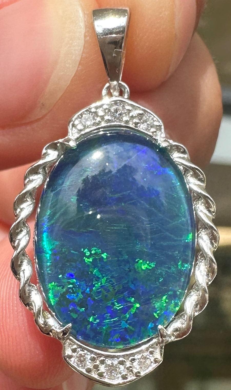 Australian muliticolored opal doublet drop pendant set in sterling silver and encrusted with cubic zirconia diamonds 17.48 cts