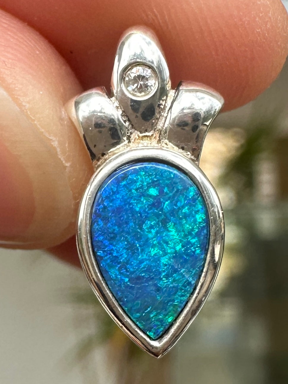 Australian muliticolored opal doublet drop pendant set in sterling silver and encrusted with cubic zirconia diamonds 5.88 cts