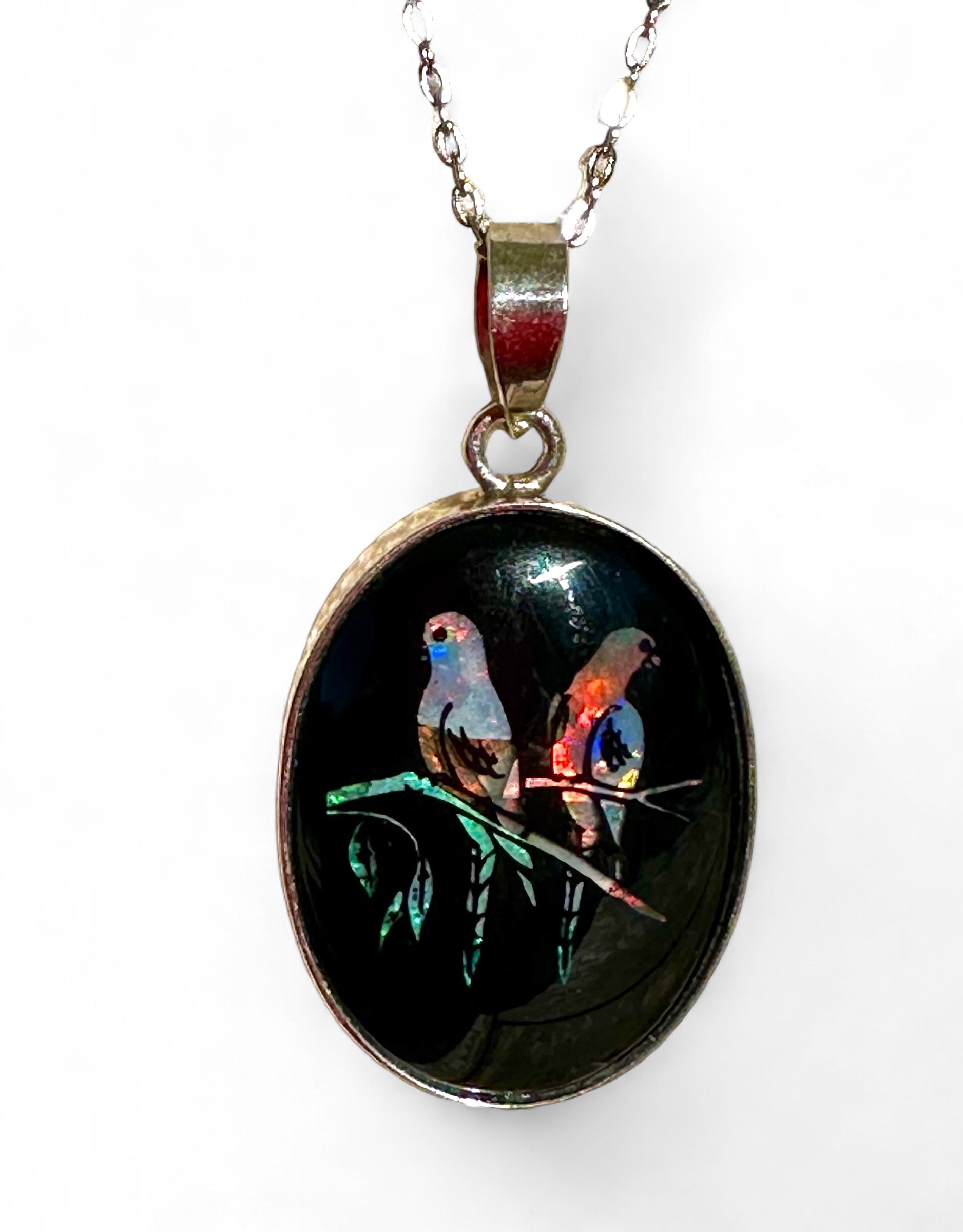 Unique opal and sterling silver pendant featuring birds