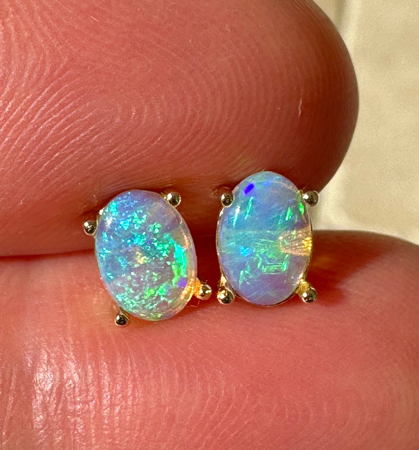 Crystal opal stud earrings set in 14k yellow gold