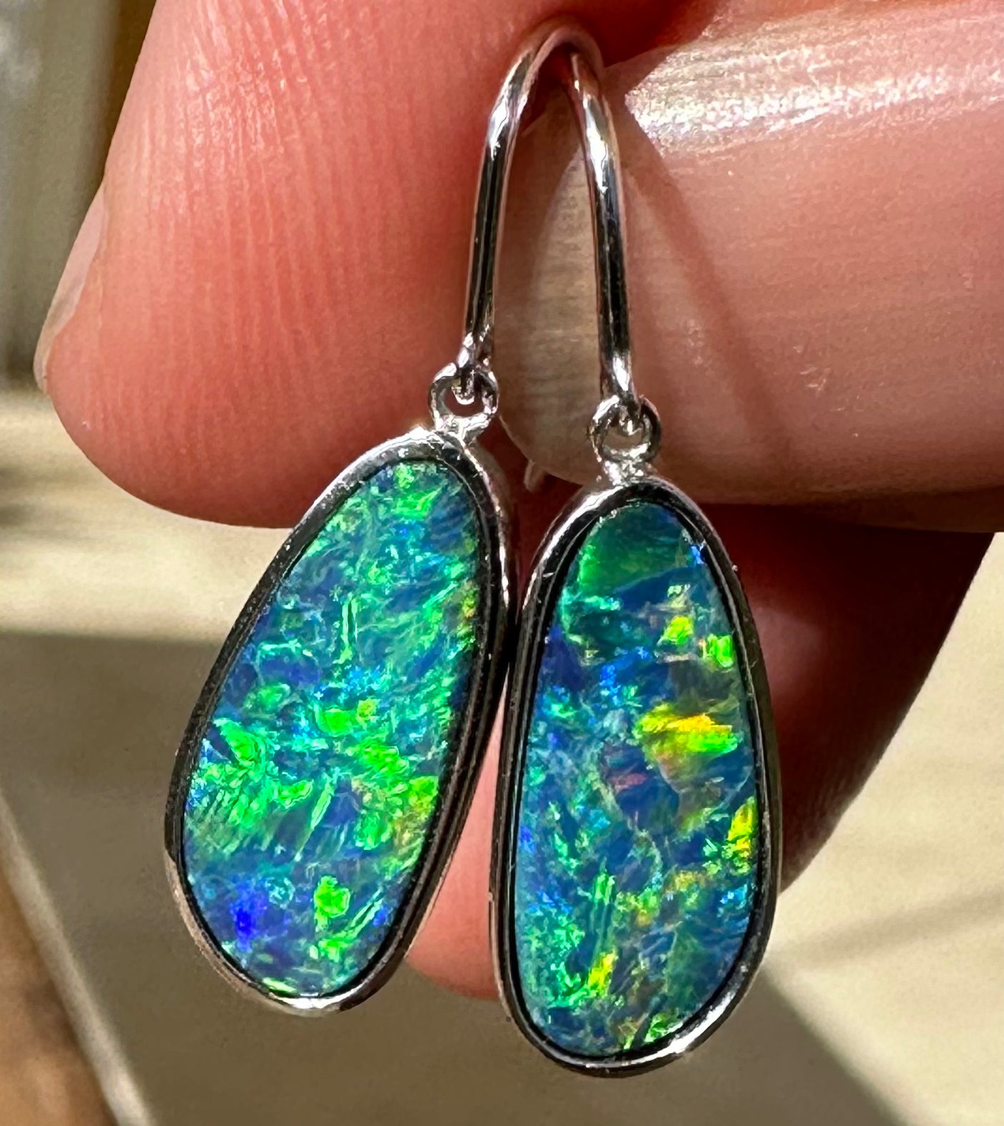 Brilliant opal earrings set in 14k white gold