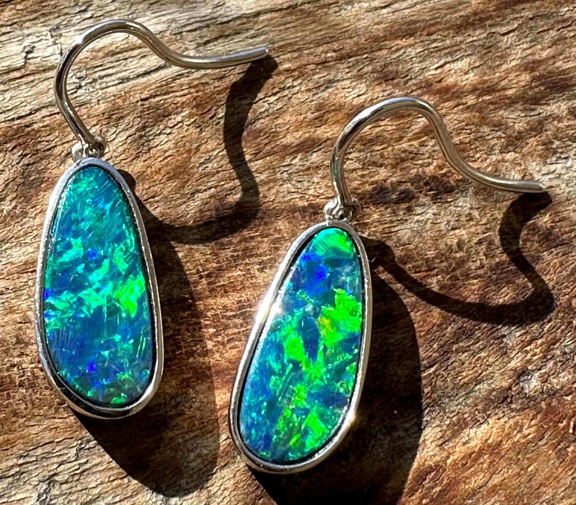 Brilliant opal earrings set in 14k white gold