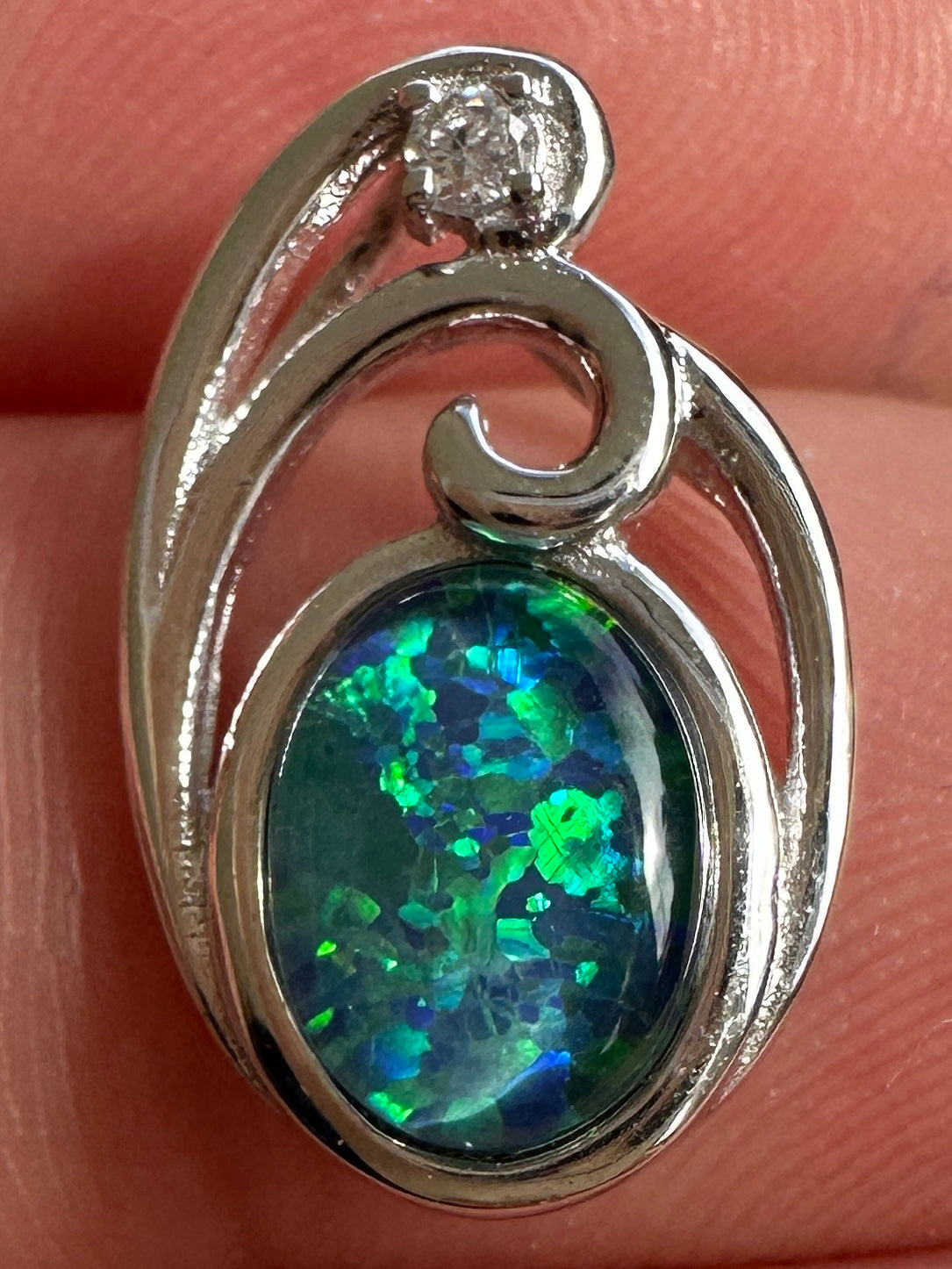 Australian muliticolored opal doublet drop pendant set in sterling silver and encrusted with cubic zirconia diamonds 6.535 cts