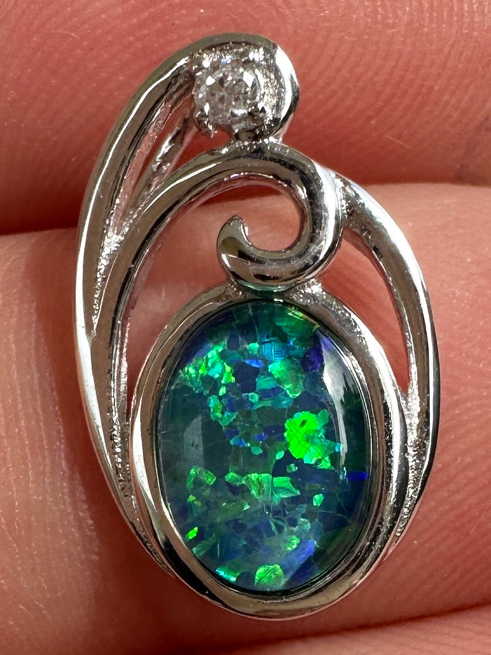 Australian muliticolored opal doublet drop pendant set in sterling silver and encrusted with cubic zirconia diamonds 6.535 cts