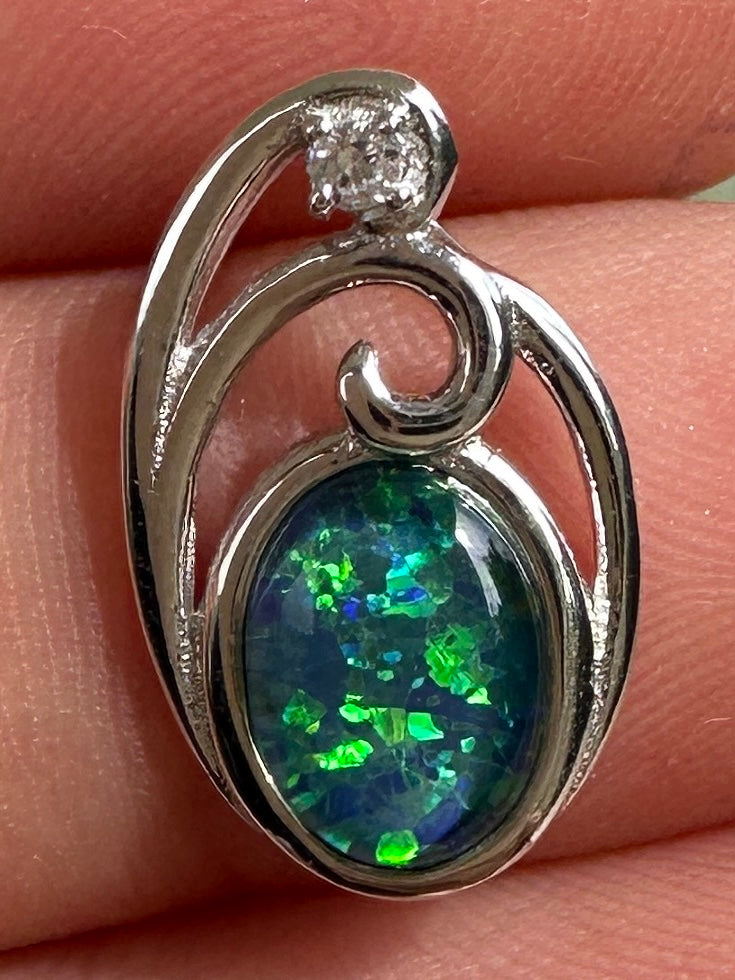 Australian muliticolored opal doublet drop pendant set in sterling silver and encrusted with cubic zirconia diamonds 6.535 cts