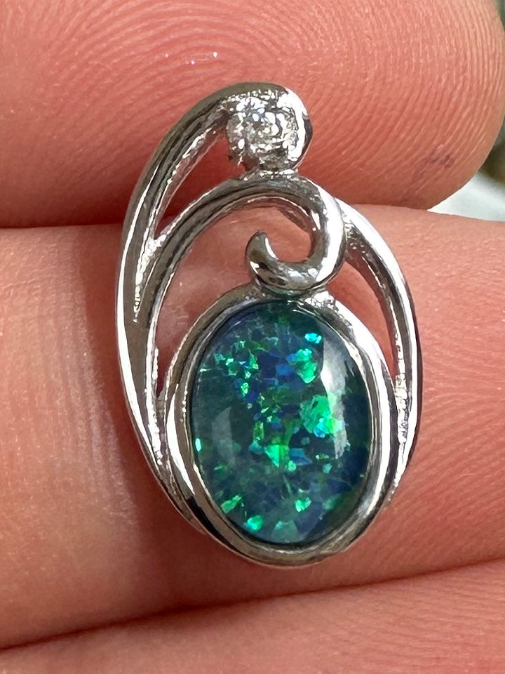Australian muliticolored opal doublet drop pendant set in sterling silver and encrusted with cubic zirconia diamonds 6.535 cts