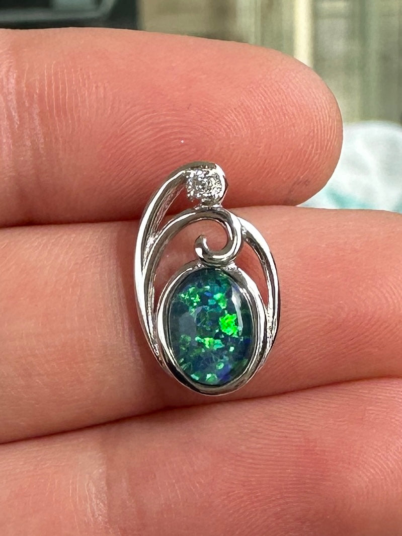 Australian muliticolored opal doublet drop pendant set in sterling silver and encrusted with cubic zirconia diamonds 6.535 cts