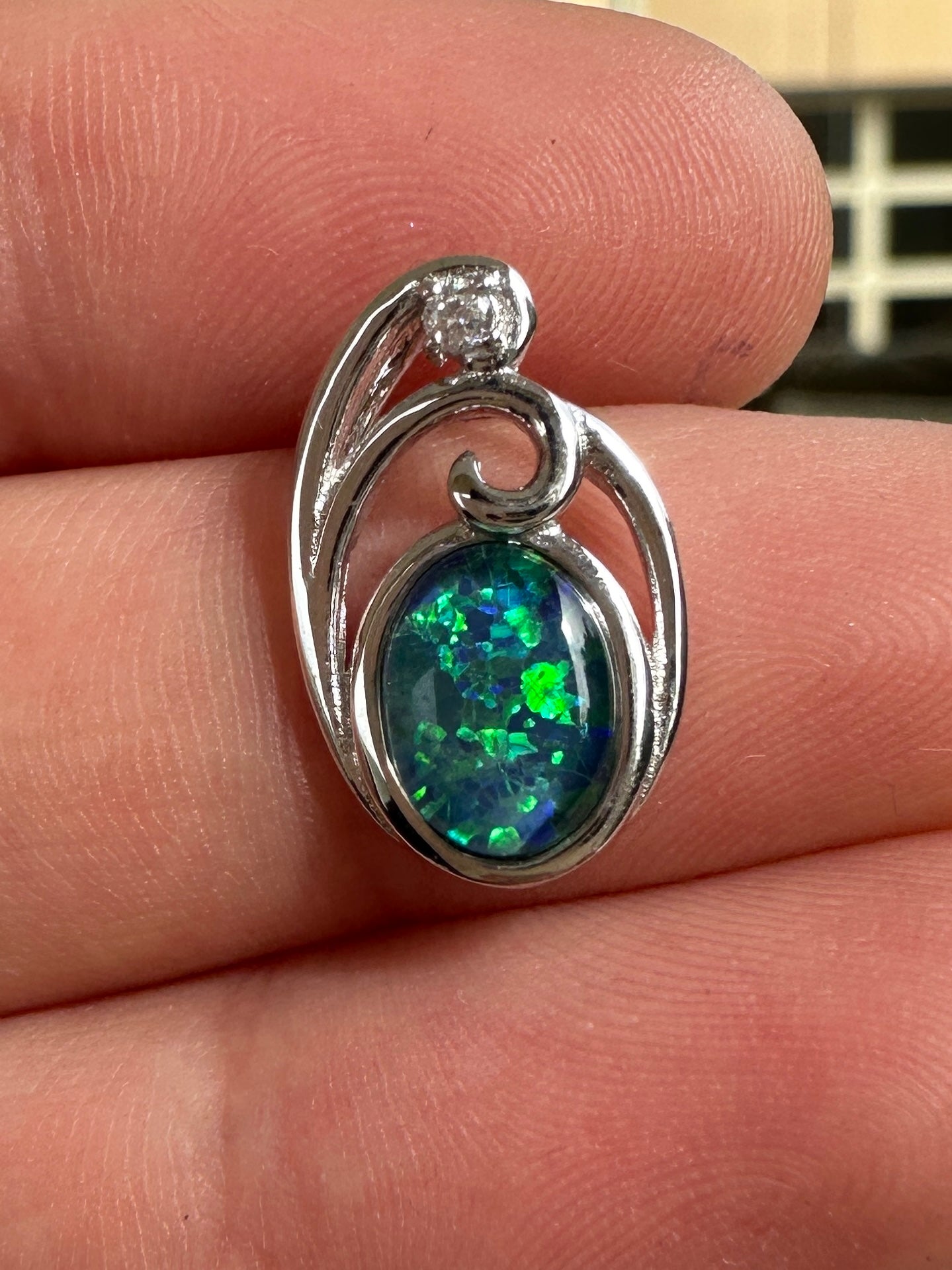 Australian muliticolored opal doublet drop pendant set in sterling silver and encrusted with cubic zirconia diamonds 6.535 cts