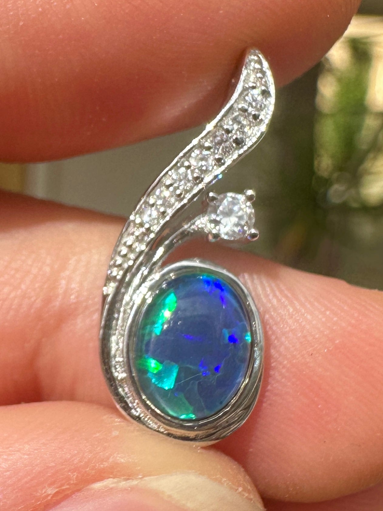 Australian muliticolored opal doublet drop pendant set in sterling silver and encrusted with cubic zirconia diamonds 7.31 cts