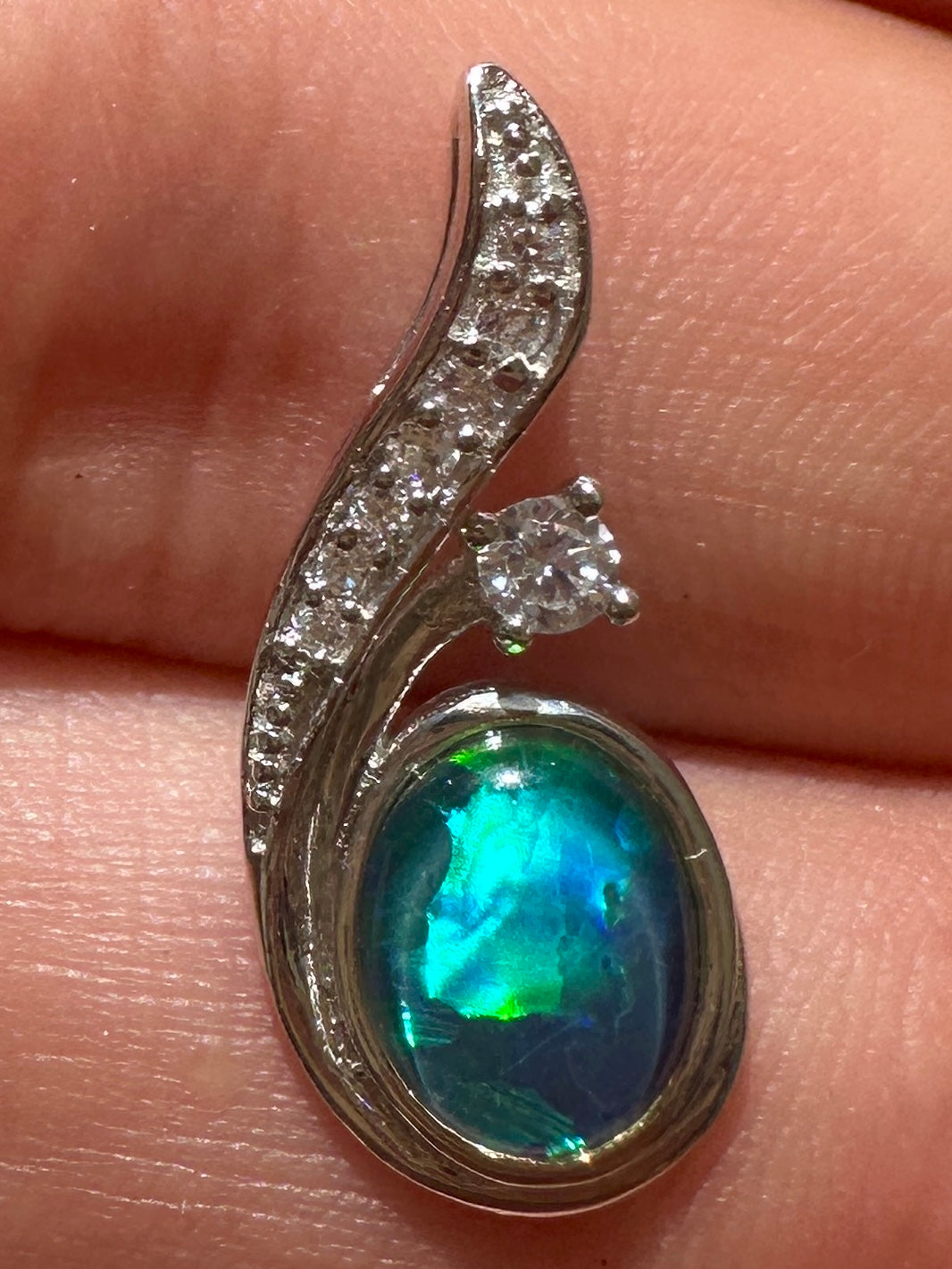 Australian muliticolored opal doublet drop pendant set in sterling silver and encrusted with cubic zirconia diamonds 7.31 cts