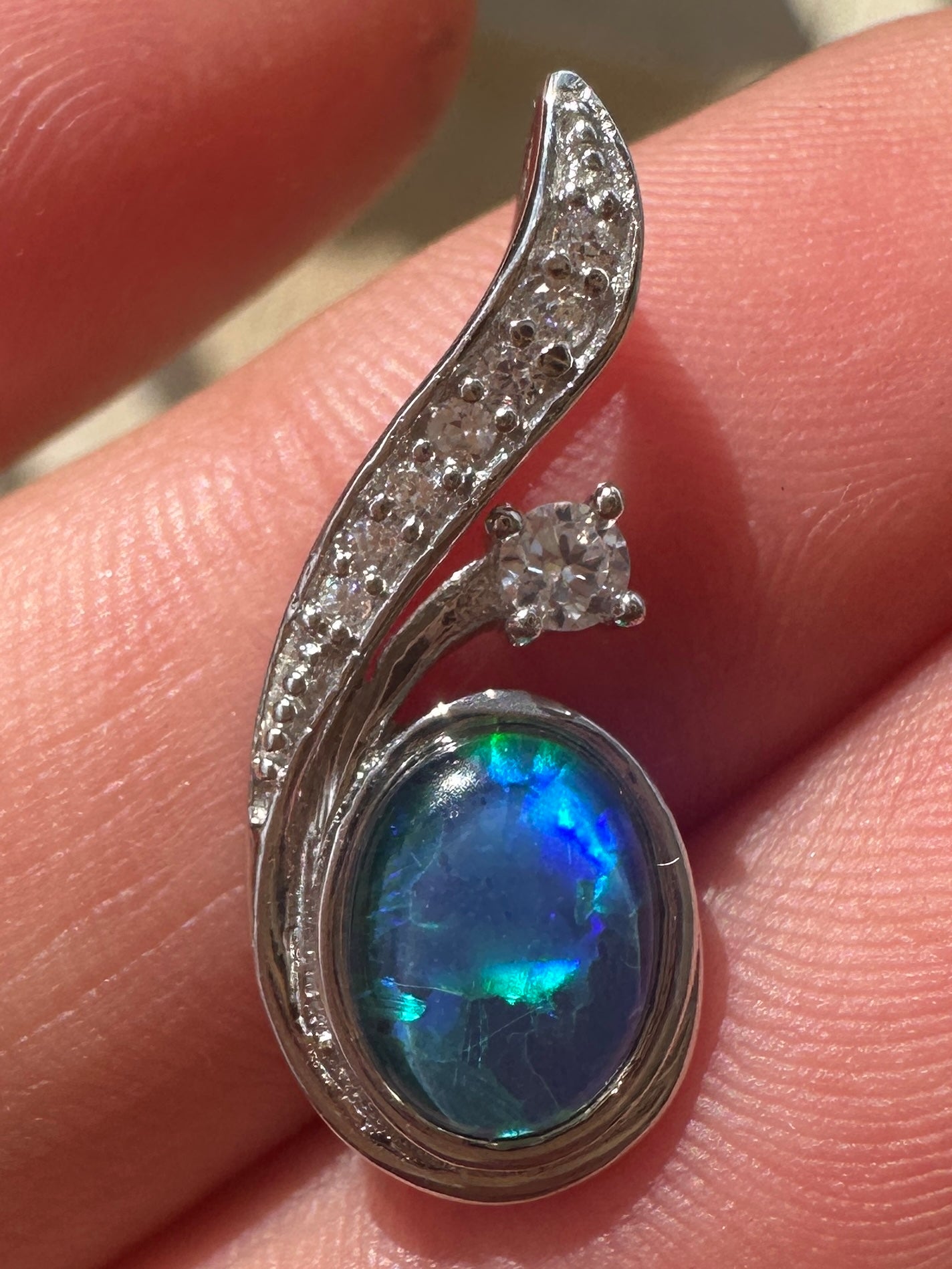 Australian muliticolored opal doublet drop pendant set in sterling silver and encrusted with cubic zirconia diamonds 7.31 cts