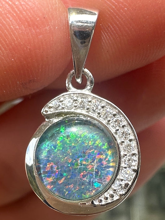 Australian muliticolored opal doublet drop pendant set in sterling silver and encrusted with cubic zirconia diamonds 7.125 cts