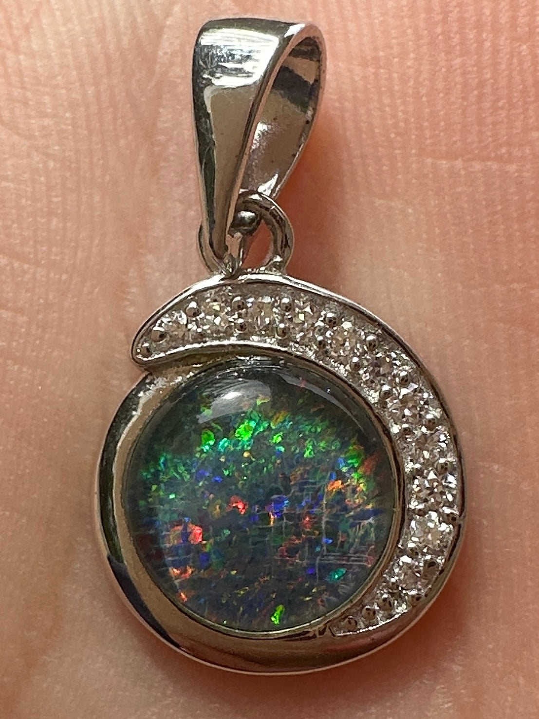 Australian muliticolored opal doublet drop pendant set in sterling silver and encrusted with cubic zirconia diamonds 7.125 cts