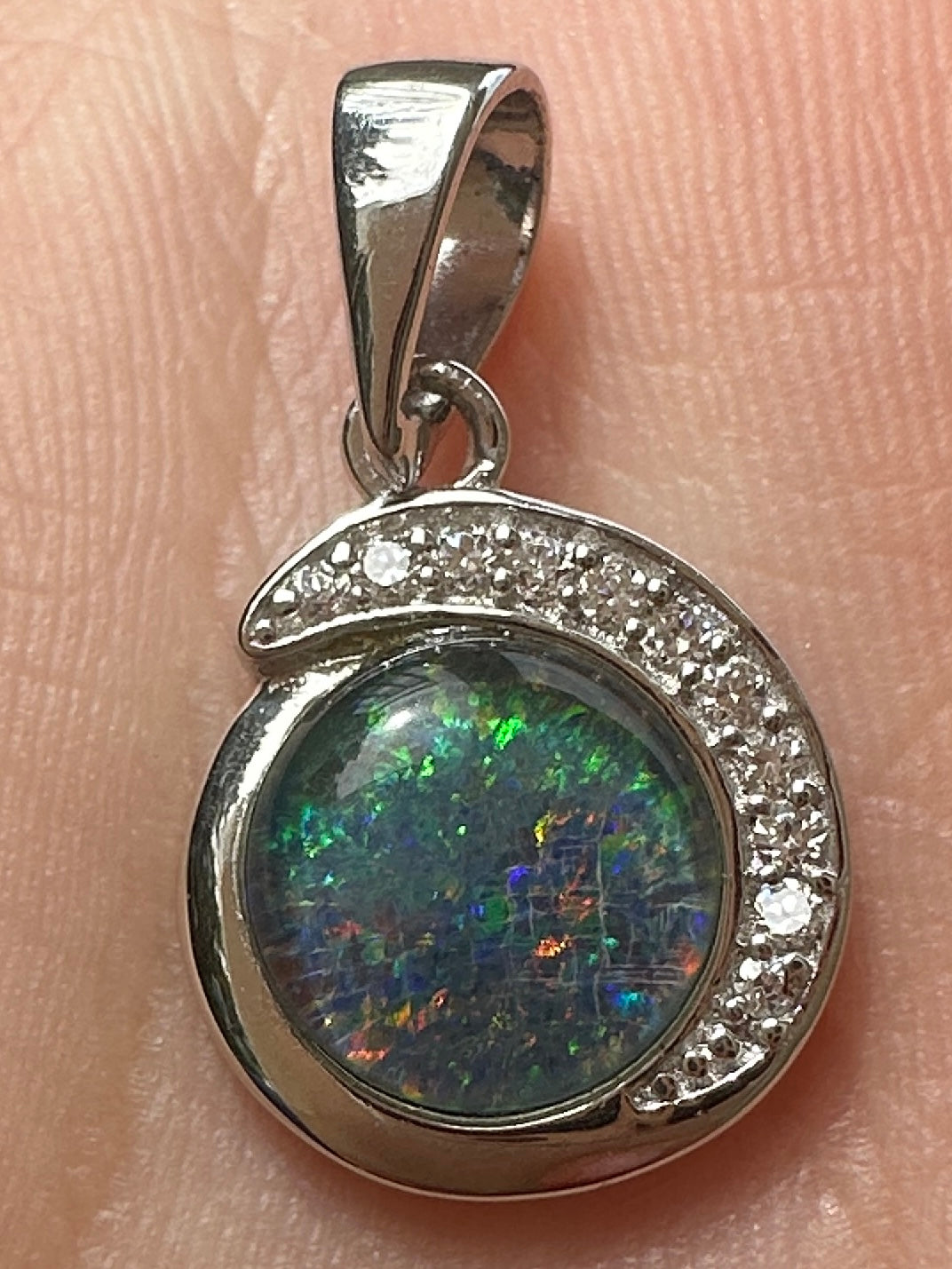 Australian muliticolored opal doublet drop pendant set in sterling silver and encrusted with cubic zirconia diamonds 7.125 cts