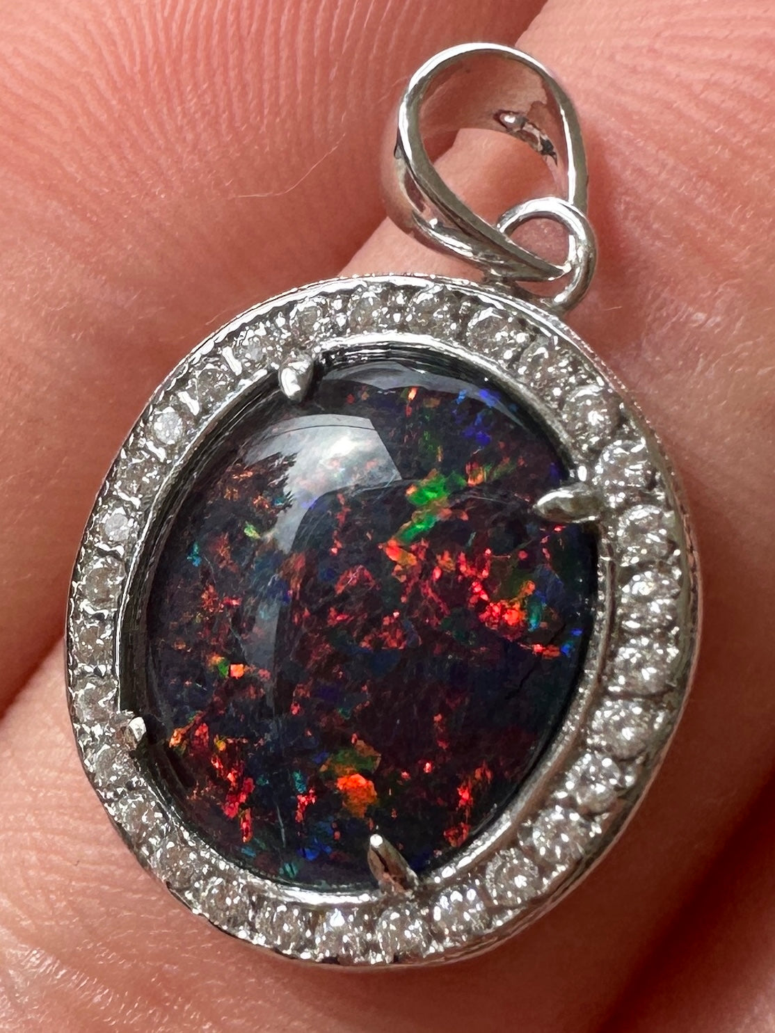 Australian muliticolored opal doublet drop pendant set in sterling silver and encrusted with cubic zirconia diamonds 10.695 cts