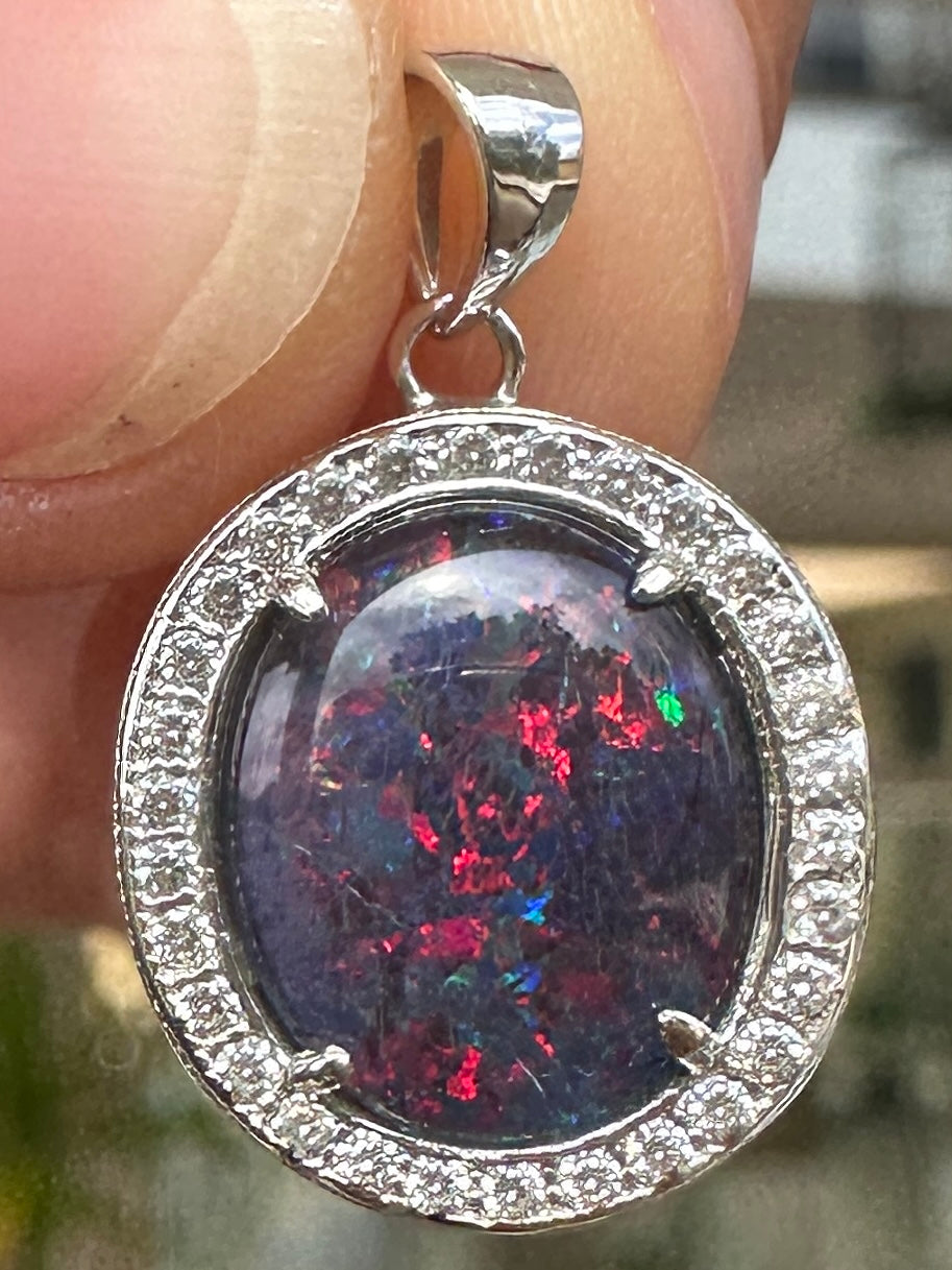 Australian muliticolored opal doublet drop pendant set in sterling silver and encrusted with cubic zirconia diamonds 10.695 cts