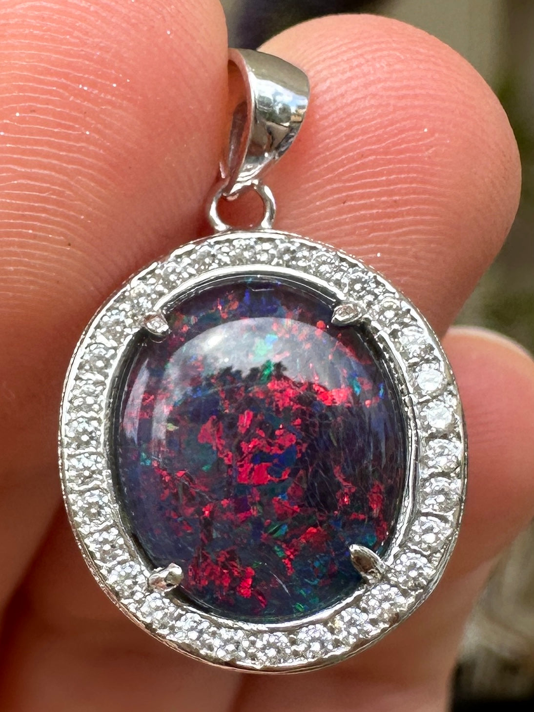Australian muliticolored opal doublet drop pendant set in sterling silver and encrusted with cubic zirconia diamonds 10.695 cts