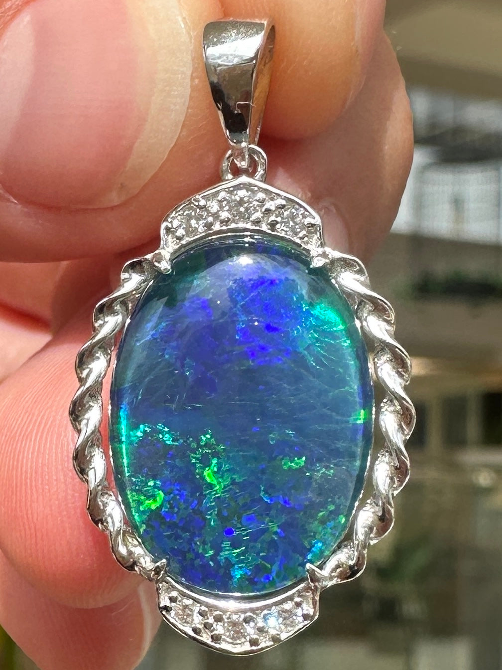Australian muliticolored opal doublet drop pendant set in sterling silver and encrusted with cubic zirconia diamonds 17.48 cts