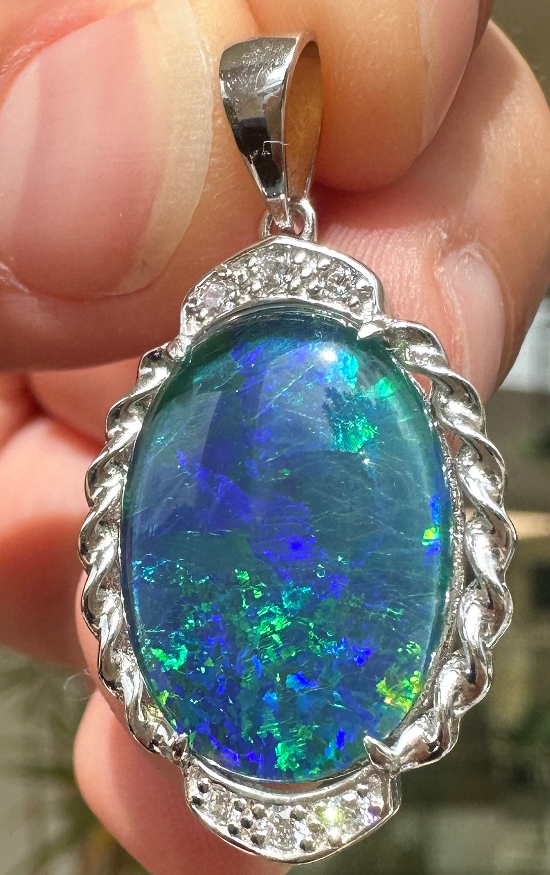 Australian muliticolored opal doublet drop pendant set in sterling silver and encrusted with cubic zirconia diamonds 17.48 cts