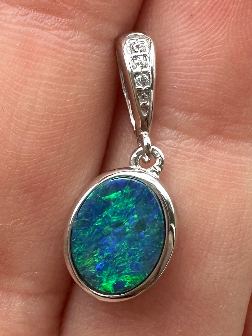 Australian muliticolored opal doublet drop pendant set in sterling silver and encrusted with cubic zirconia diamonds 5.835 cts