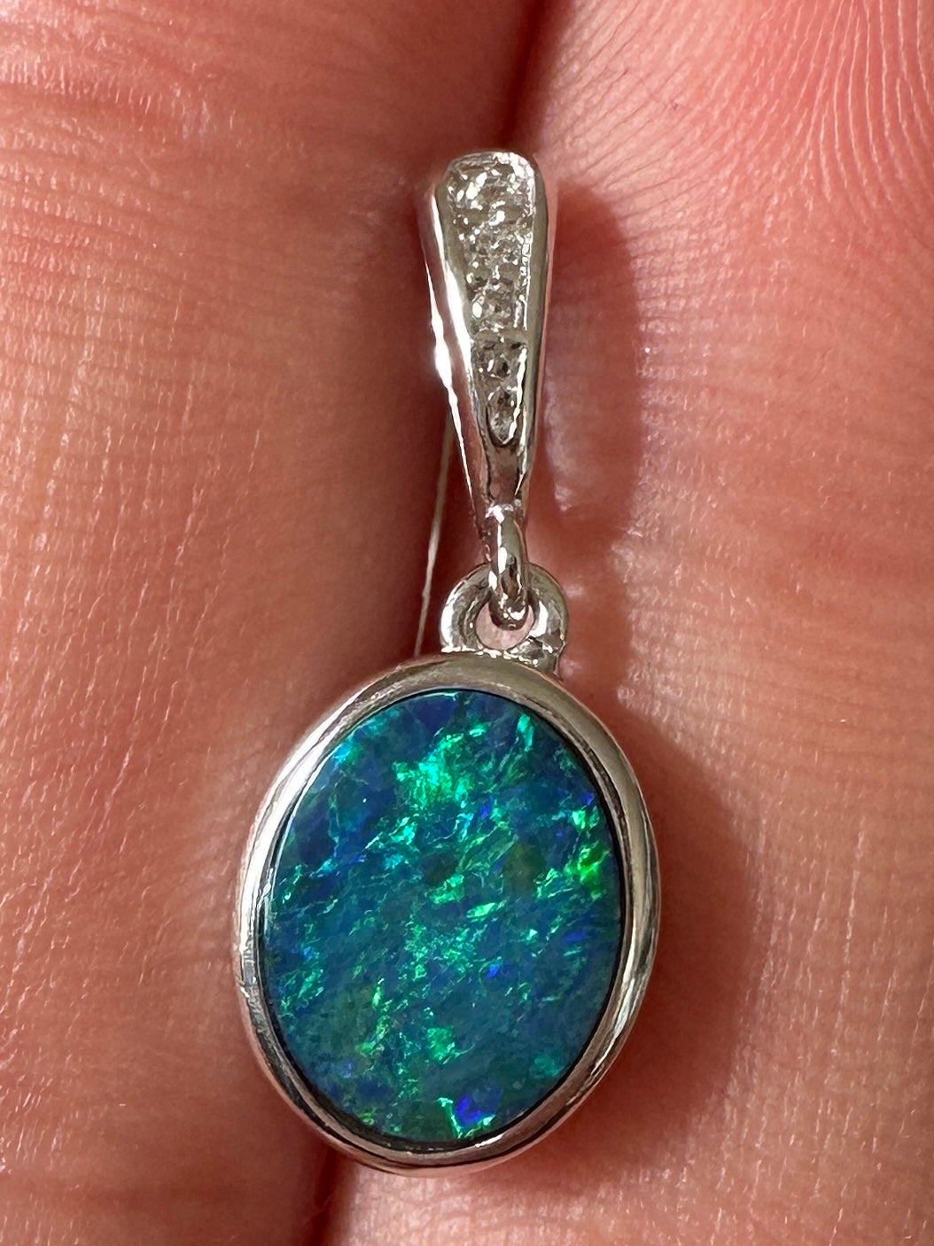 Australian muliticolored opal doublet drop pendant set in sterling silver and encrusted with cubic zirconia diamonds 5.835 cts