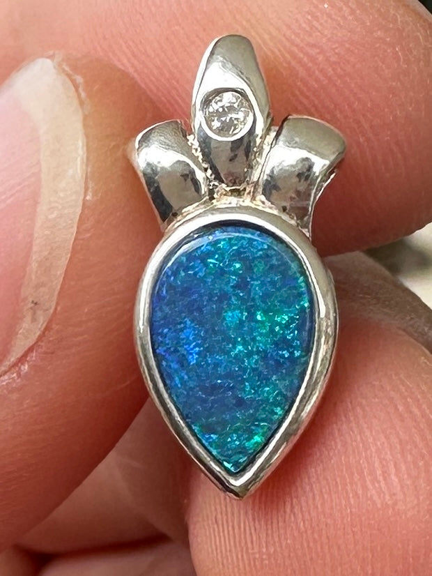 Australian muliticolored opal doublet drop pendant set in sterling silver and encrusted with cubic zirconia diamonds 5.88 cts