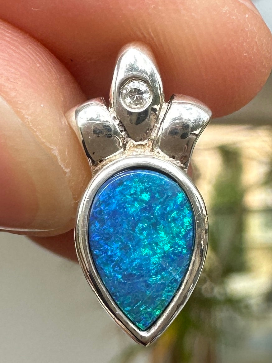 Australian muliticolored opal doublet drop pendant set in sterling silver and encrusted with cubic zirconia diamonds 5.88 cts