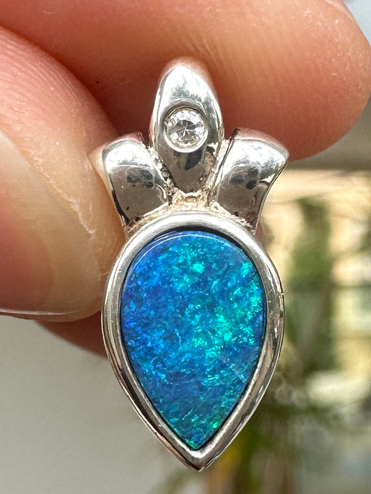 Australian muliticolored opal doublet drop pendant set in sterling silver and encrusted with cubic zirconia diamonds 5.88 cts