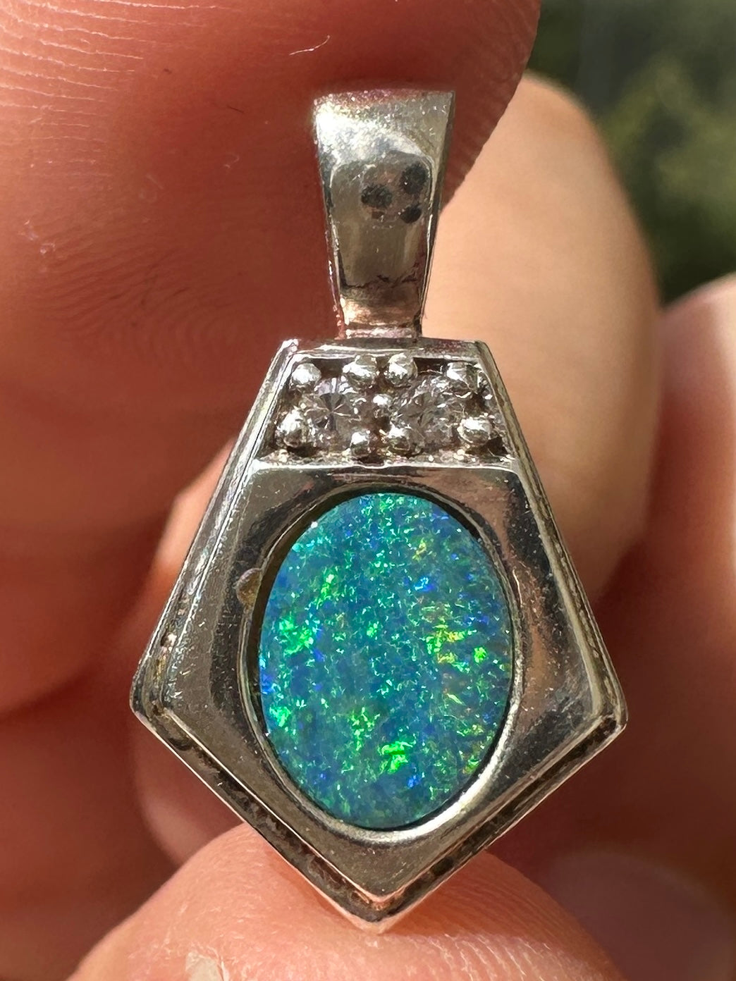 Australian muliticolored opal doublet drop pendant set in sterling silver and encrusted with cubic zirconia diamonds 12.545 cts