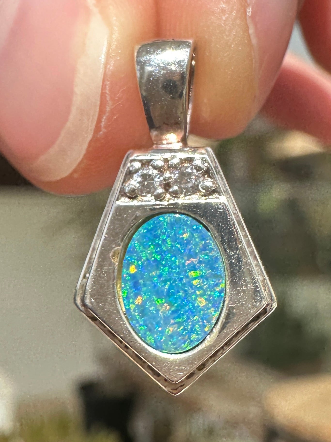 Australian muliticolored opal doublet drop pendant set in sterling silver and encrusted with cubic zirconia diamonds 12.545 cts