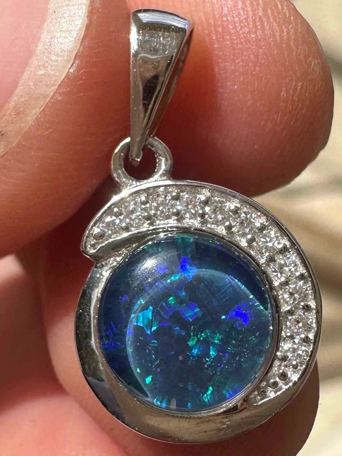 Australian muliticolored opal doublet drop pendant set in sterling silver and encrusted with cubic zirconia diamonds 7.215 cts