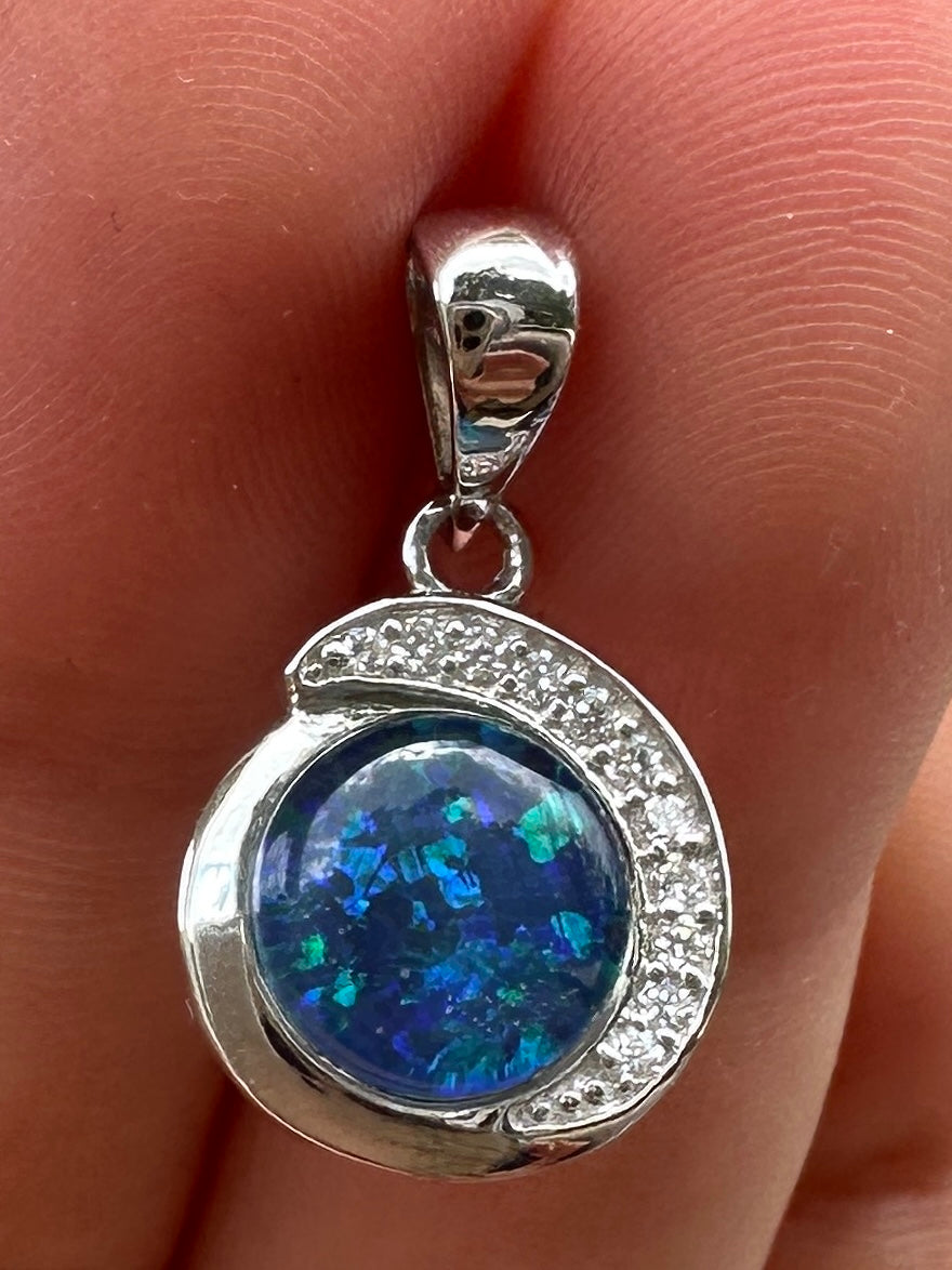 Australian muliticolored opal doublet drop pendant set in sterling silver and encrusted with cubic zirconia diamonds 7.215 cts