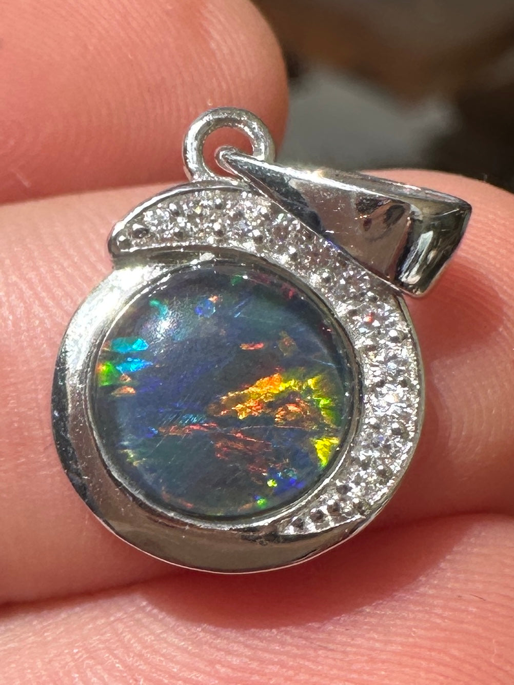 Australian muliticolored opal doublet drop pendant set in sterling silver and encrusted with cubic zirconia diamonds 7.135 cts