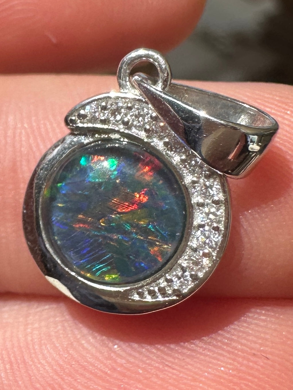 Australian muliticolored opal doublet drop pendant set in sterling silver and encrusted with cubic zirconia diamonds 7.135 cts