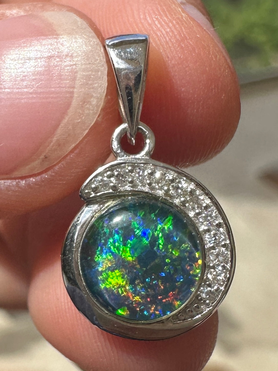 Australian muliticolored opal doublet drop pendant set in sterling silver and encrusted with cubic zirconia diamonds 7.25 cts