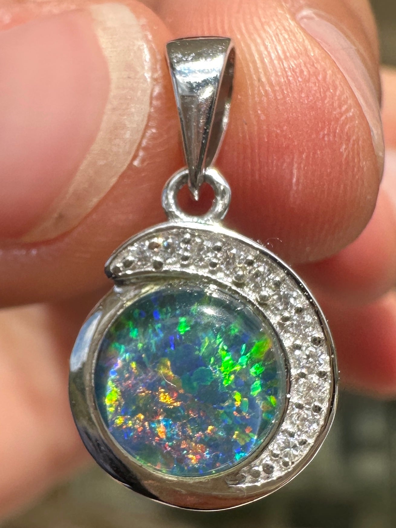 Australian muliticolored opal doublet drop pendant set in sterling silver and encrusted with cubic zirconia diamonds 7.25 cts