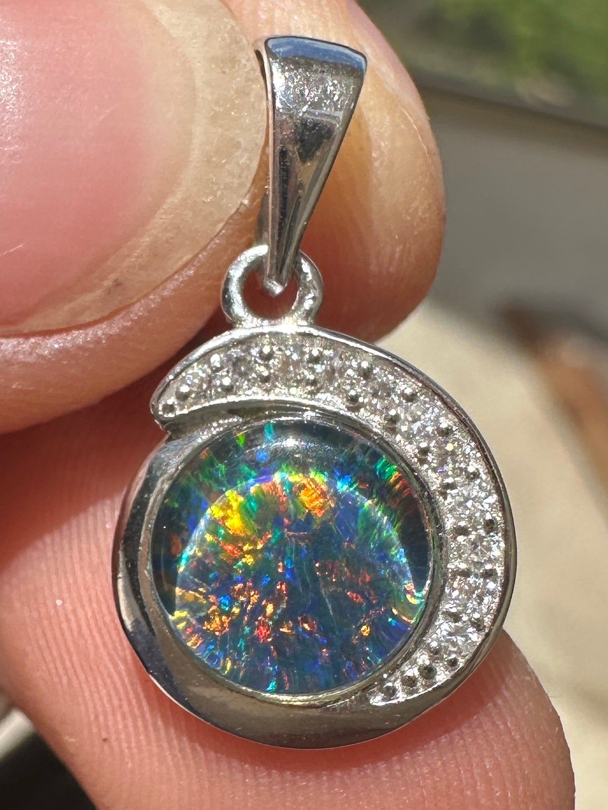 Australian muliticolored opal doublet drop pendant set in sterling silver and encrusted with cubic zirconia diamonds 6.965 cts