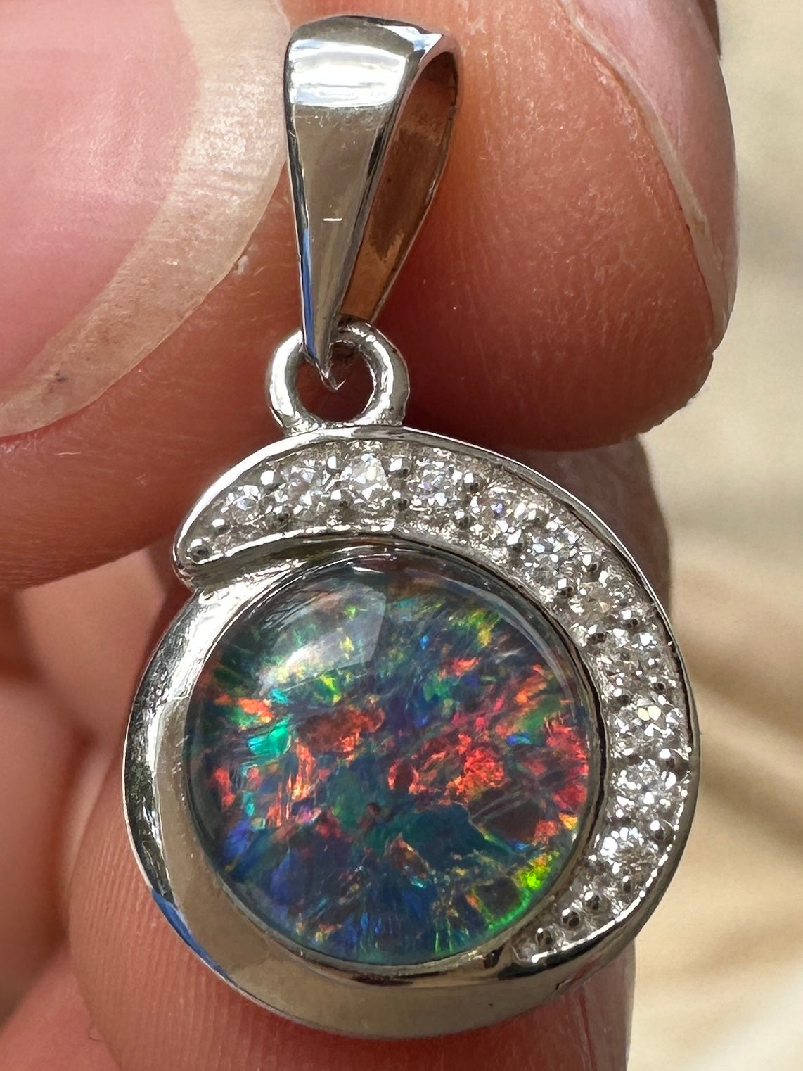 Australian muliticolored opal doublet drop pendant set in sterling silver and encrusted with cubic zirconia diamonds 7.23 cts