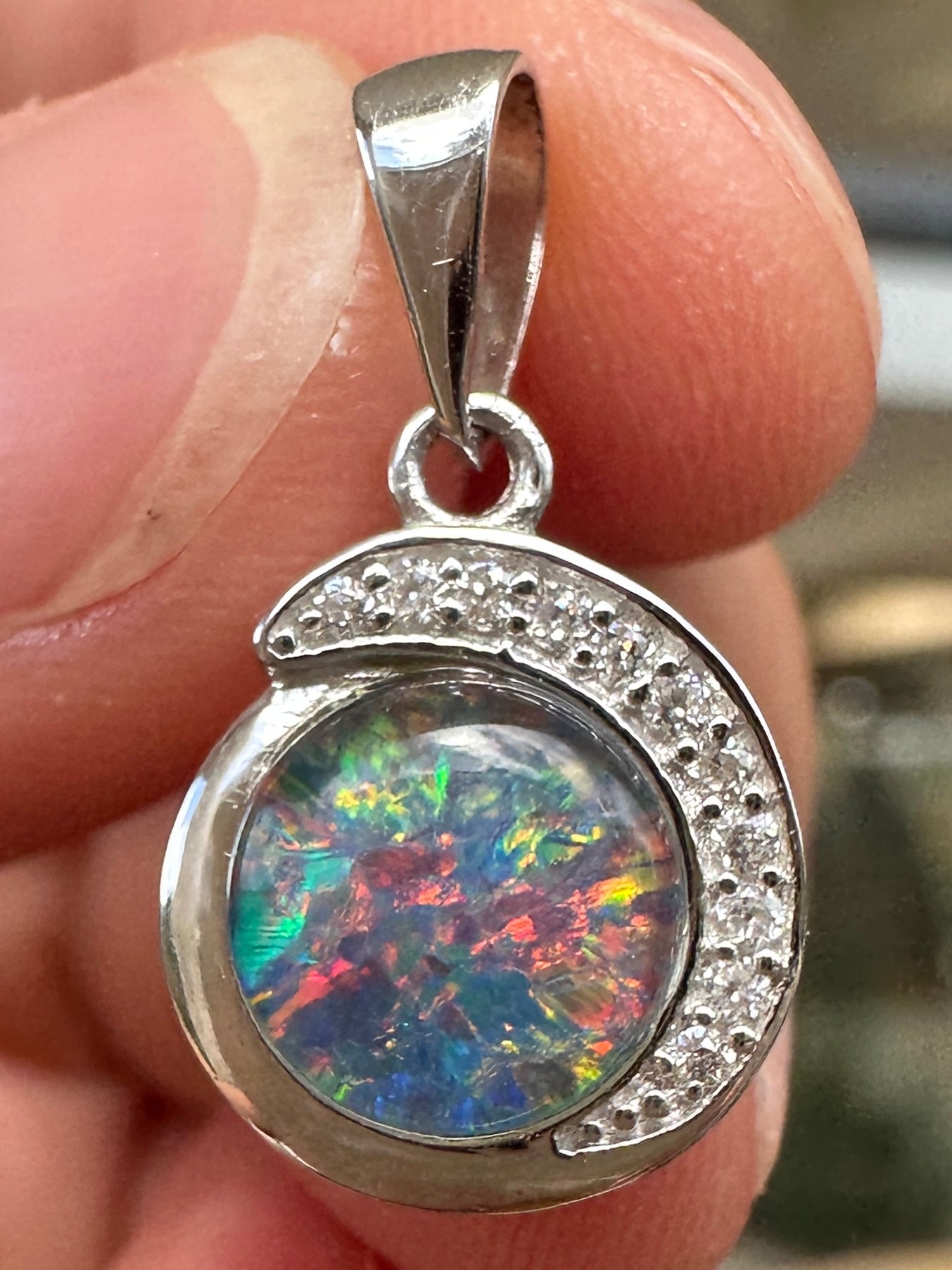 Australian muliticolored opal doublet drop pendant set in sterling silver and encrusted with cubic zirconia diamonds 7.23 cts