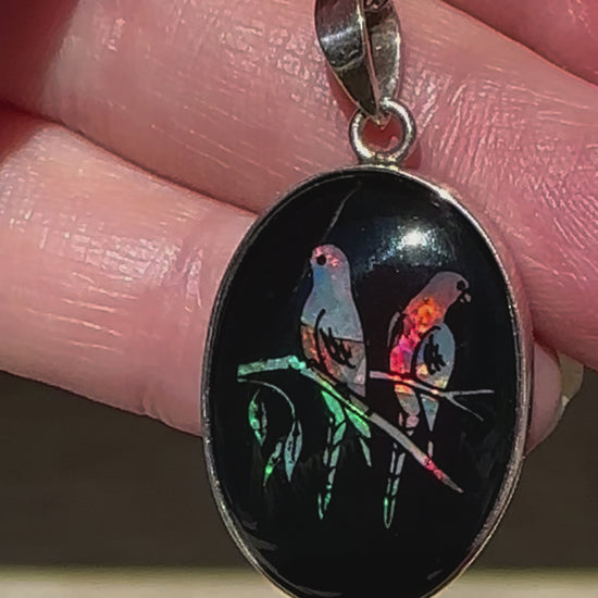 Unique opal and sterling silver pendant featuring birds