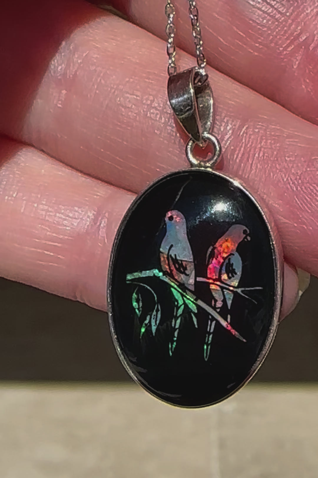 Unique opal and sterling silver pendant featuring birds