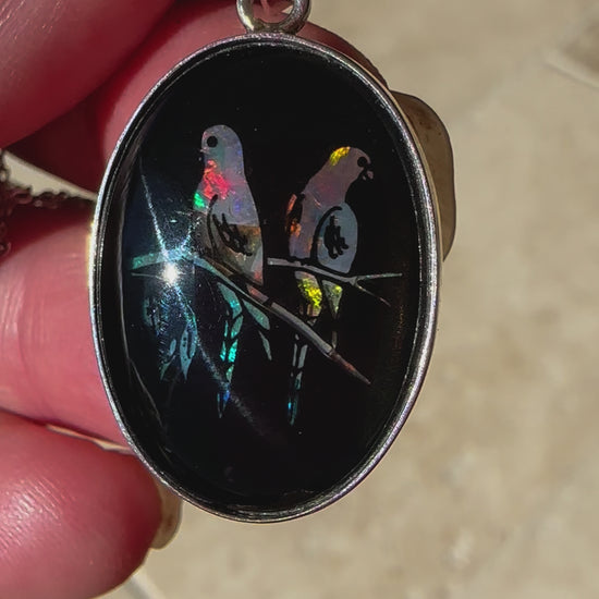 Unique opal and sterling silver pendant featuring birds