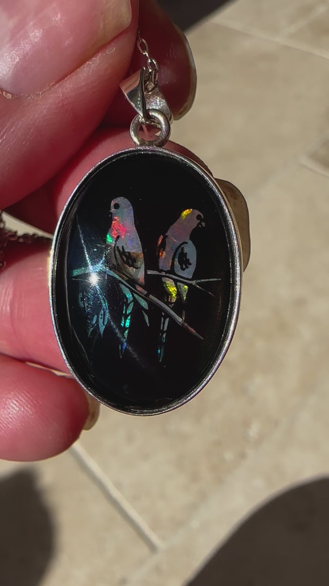 Unique opal and sterling silver pendant featuring birds